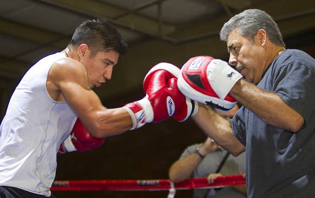 Las Vegan welterweight boxer Jessie Vargas works on his timing with trainer Robert Alcazar during a workout at Top Rank Gym Tuesday Sept. 4, 2012. Vargas will fight Aron Martinez of Los Angeles at the Hard Rock Hotel on Thursday, September 13.