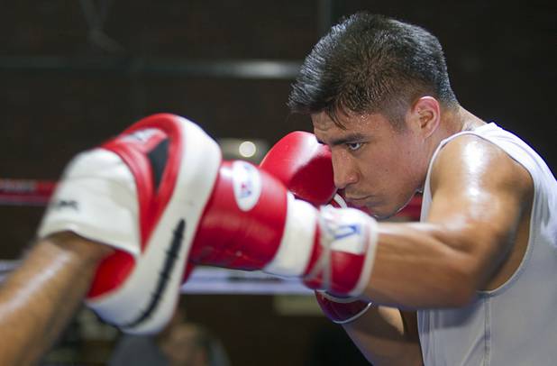 Las Vegan welterweight boxer Jessie Vargas works on his timing with trainer Robert Alcazar during a workout at Top Rank Gym Tuesday Sept. 4, 2012. Vargas will fight Aron Martinez of Los Angeles at the Hard Rock Hotel on Thursday, September 13.