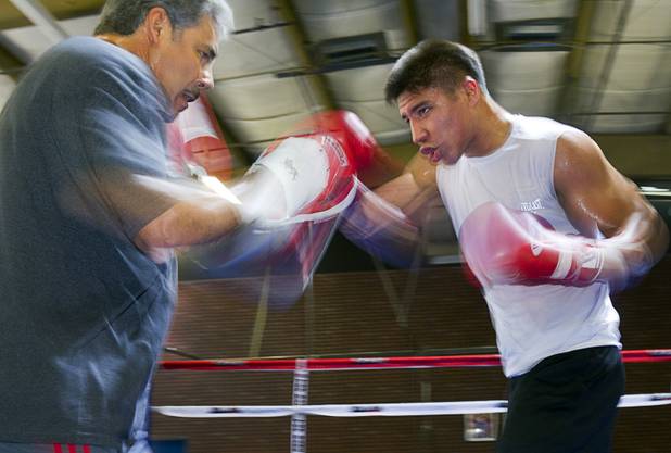 Las Vegan welterweight boxer Jessie Vargas works on his timing with trainer Robert Alcazar during a workout at Top Rank Gym Tuesday Sept. 4, 2012. Vargas will fight Aron Martinez of Los Angeles at the Hard Rock Hotel on Thursday, September 13.