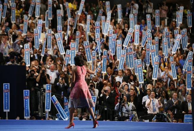 First Lady Michelle Obama waves after addressing the Democratic National Convention in Charlotte, N.C., on Tuesday, Sept. 4, 2012. 