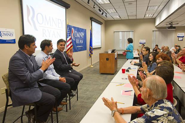 Craig Romney, center, the youngest son of GOP presidential candidate Mitt Romney, revives applause as he is introduced during a Hispanic small business dialogue at the Greater Las Vegas Association of Realtors offices Wednesday, Sept. 5, 2012. With Romney are U.S. Congressman Raul Labrador, left, (R-ID) and Hector Barreto, center, former administrator of the U.S. Small Business Administration.