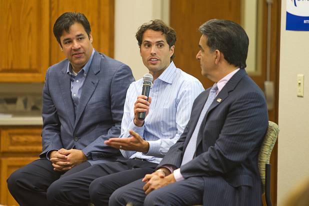 Craig Romney, center, the youngest son of GOP presidential candidate Mitt Romney, responds to a question during a Hispanic small business dialogue at the Greater Las Vegas Association of Realtors offices Wednesday, Sept. 5, 2012. With Romney are U.S. Congressman Raul Labrador, left, (R-ID) and Hector Barreto, center, former administrator of the U.S. Small Business Administration.