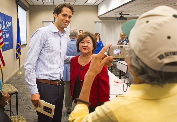 Craig Romney, the youngest son of GOP presidential candidate Mitt Romney, poses for photos after a Hispanic small business dialogue at the Greater Las Vegas Association of Realtors offices Wednesday, Sept. 5, 2012.