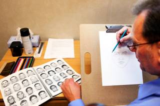 Detective David Prichard, a police sketch artist, works on an example sketch of a nonexistent subject in his office at Las Vegas Metropolitan Police Department Headquarters in Las Vegas on Wednesday, September 5, 2012.