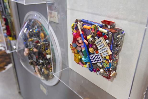 A collage by artist Joyce Straus is displayed at the Artifact boutique Thursday, Sept. 6, 2012. The shop specializes in recycled, up cycled and re-purposed items.