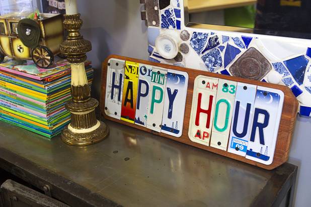 License plate artwork is displayed at the Artifact boutique in The Market LV portion of Tivoli Village Thursday, Sept. 6, 2012. The shop specializes in recycled, up cycled and re-purposed items.