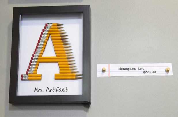 Mongram Art is displayed at the Artifact boutique in The Market LV portion of Tivoli Village Thursday, Sept. 6, 2012. The shop specializes in recycled, up cycled and re-purposed items.