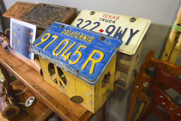 Bird houses with license plate roofs are displayed at the Artifact boutique in The Market LV portion of Tivoli Village Thursday, Sept. 6, 2012. The shop specializes in recycled, up cycled and re-purposed items.