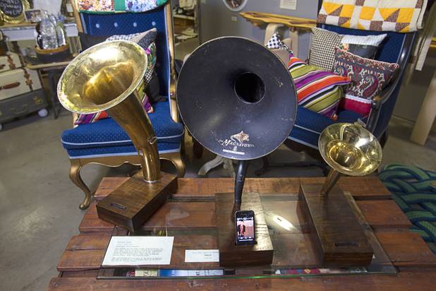 Docks for playing music from an iPhone are displayed at the Artifact boutique in The Market LV portion of Tivoli Village Thursday, Sept. 6, 2012. The docks use a hollow wooden base and a reclaimed metal horn to amplify music from an iPhone's speaker. No batteries or electricity needed. The shop specializes in recycled, up cycled and re-purposed items.