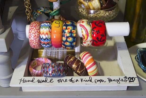 Hand-painted bracelets made from recycled paper are displayed at the Artifact boutique in The Market LV portion of Tivoli Village Thursday, Sept. 6, 2012. The shop specializes in recycled, up cycled and re-purposed items.