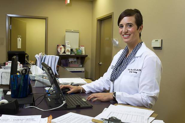 Dr. Aimee Fleury pulls up a patient record at a nurse's station in the Women's Cancer Center of Nevada Thursday, Sept. 6, 2012. Fleury, a gynecologic oncologist, joined the center this August.