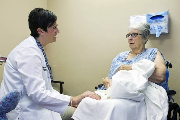 Dr. Aimee Fleury listens to Anita Harris of Kingman, Ariz. at the Women's Cancer Center of Nevada, Thursday, Sept. 6, 2012. Fleury, a gynecologic oncologist, joined the center this August.