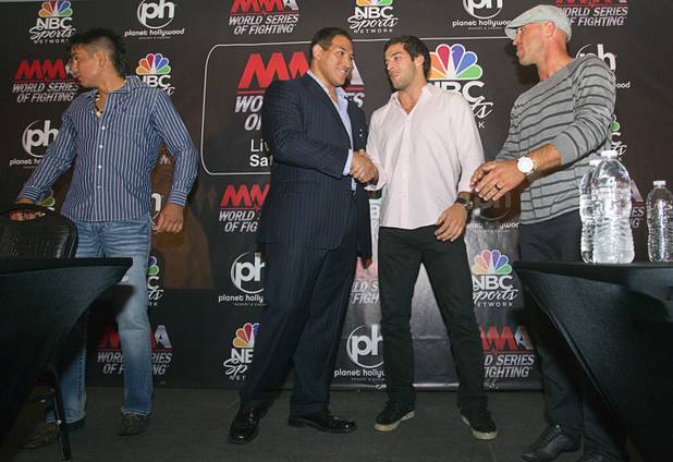 World Series of Fighting league president Ray Seto, center left, shakes hands with welterweight fighter Gregor Gracie of Brazil during a news conference at the Planet Hollywood Live theater (formerly the Theatre for the Performing Arts) at Planet Hollywood Thursday, Sept. 6, 2012. Also on stage are Miguel Torres, left, and Josh Burkman. The new league will debut with a fight card broadcast on NBC at the theater on Nov. 3.