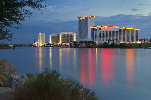 Laughlin casino lights are reflected in the Colorado River at sunset Sunday, Sept. 9. 2012.