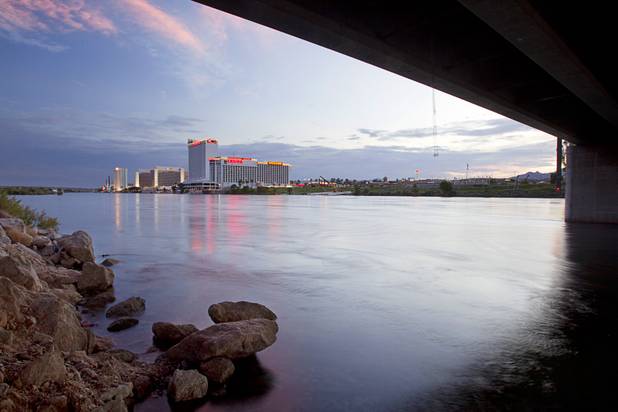 Laughlin casino lights are reflected in the Colorado River at Sunset sunday, Sept. 9. 2012.