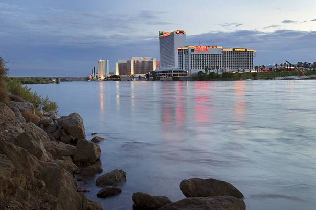 Laughlin casino lights are reflected in the Colorado River at Sunset sunday, Sept. 9. 2012.