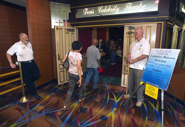 Greeters Tom Hewitt, left, and Bob Blanks flank the door to Don's Celebrity Theatre before St. John the Baptist Catholic Church Mass at the Riverside Casino in Laughlin Sunday, Sept. 9. 2012. The church is the only Catholic church that holds weekly Mass in a casino, said Father Charlie Urnick.