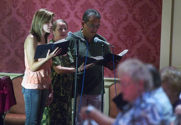 Choir members Chanel Kruz, Sheila Patton, center, and Joe Serra sing during St. John the Baptist Catholic Church Mass at the Riverside Casino in Laughlin Sunday, Sept. 9. 2012. The church is the only Catholic church that holds weekly Mass in a casino, said Father Charlie Urnick.