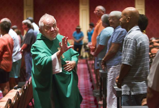 Father Charlie Urnick greets worshippers during St. John the Baptist Catholic Church Mass at the Riverside Casino in Laughlin Sunday, Sept. 9. 2012. The church is the only Catholic church that holds weekly Mass in a casino, Urnick said.