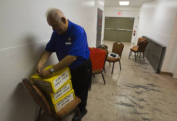 Father Charlie Urnick packs up donation boxes after a St. John the Baptist Catholic Church Mass at the Riverside Casino in Laughlin Sunday, Sept. 9. 2012. The church is the only Catholic church that holds weekly Mass in a casino, Urnick said.