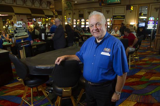 Father Charlie Urnick of St. John the Baptist Catholic Church poses on the casino floor following Mass at the Riverside Casino in Laughlin Sunday, Sept. 9. 2012. The church is the only Catholic church that holds weekly Mass in a casino, Urnick said.