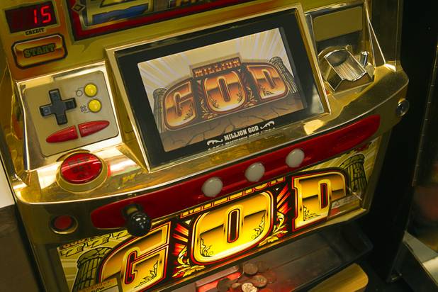 A God slot machine is displayed in Father Charlie Urnick's  office in Laughlin Sunday, Sept. 9. 2012. The church is the only Catholic church that holds weekly Mass in a casino, said Father Charlie Urnick.