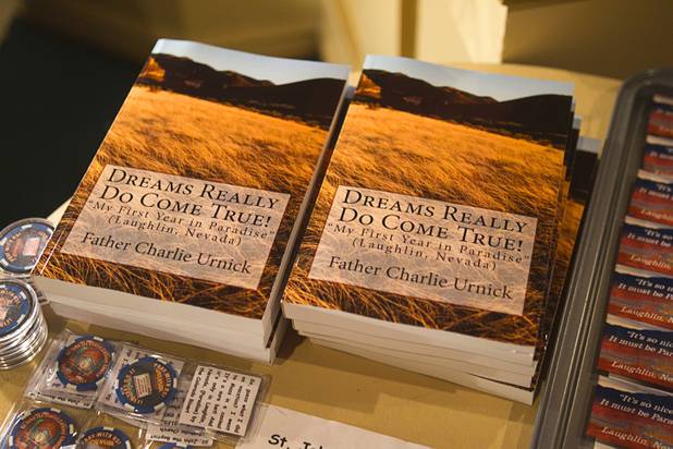 Books by Father Charlie Urnick are displayed in a gift area before St. John the Baptist Catholic Church Mass at the Riverside Casino in Laughlin Sunday, Sept. 9. 2012. The church is the only Catholic church that holds weekly Mass in a casino, Urnick said.