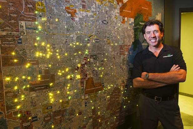 Frank Gatski, CEO, poses by a map of the Las Vegas Valley in a conference room at Gatski Commercial Real Estate Services Monday, Sept. 10, 2012. Lights on the map indicate Gatski properties. The office recently completed an interior renovation.