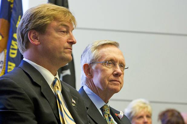 Sens. Dean Heller, left, and Harry Reid attend a Memorial Day ceremony in Boulder City on May 30, 2011.