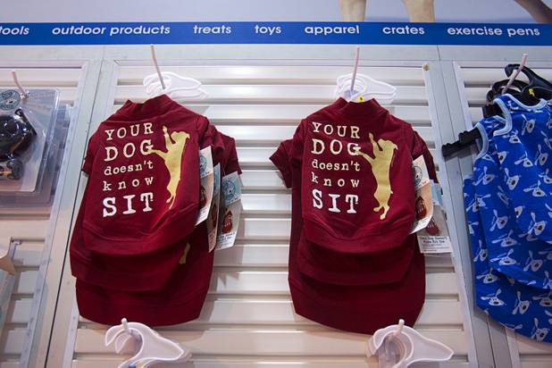 Pet clothes are displayed in the Pet Edge booth during SuperZoo, a trade show for the pet industry, at the Mandalay Bay Convention Center Tuesday, Sept. 11, 2012.