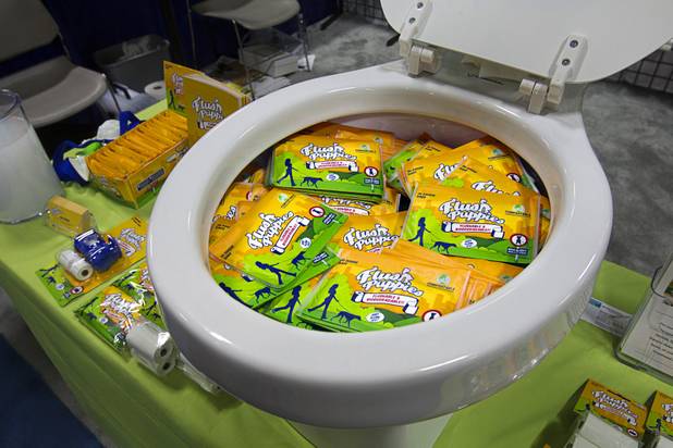 Flush Puppies, flushable and biodegradable pet waste bags, are displayed during SuperZoo, a trade show for the pet industry, at the Mandalay Bay Convention Center Tuesday, Sept. 11, 2012. Flushing pet waste is more environmentally friendly that disposing of the waste in a landfill, said Josh Spoont, co-CEO (Chief Excretement Officer - according to his business card).