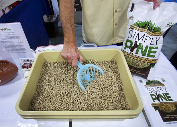 Simply Pine pellet kitty litter is displayed during SuperZoo, a trade show for the pet industry, at the Mandalay Bay Convention Center Tuesday, Sept. 11, 2012. The product has no dust and no tracking. The moisture absorbing pellets are made from the sawdust of northeastern white pine trees.