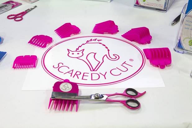 A Scaredy Cut home pet grooming kit is displayed during SuperZoo, a trade show for the pet industry, at the Mandalay Bay Convention Center Tuesday, Sept. 11, 2012. Scissors are adapted to use hair clipper's attachment guide combs for pets that are bothered by the noise or vibration of electric clippers.