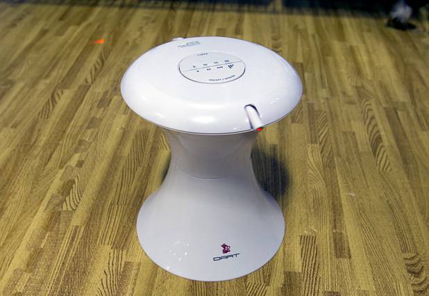 A Dart Duo by FroliCat is demonstrated during SuperZoo, a trade show for the pet industry, at the Mandalay Bay Convention Center Tuesday, Sept. 11, 2012. The rotating laser light toy has adjustable speeds and timer settings and 16 play combinations.
