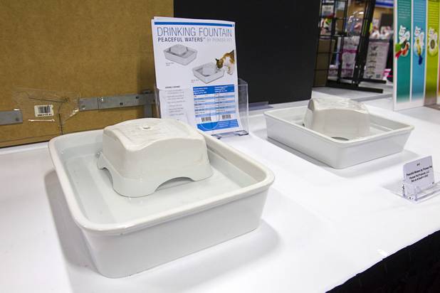 Peaceful Water drinking fountains by Pioneer Pet are displayed during SuperZoo, a trade show for the pet industry, at the Mandalay Bay Convention Center Tuesday, Sept. 11, 2012.