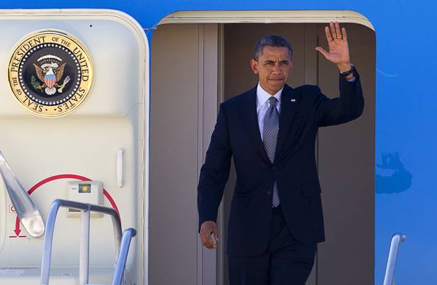 President Barack Obama waves from Air Force One after arriving at McCarran International Airport Wednesday, Sept. 12, 2012.  Obama will be making a campaign stop at Cashman Field Center.