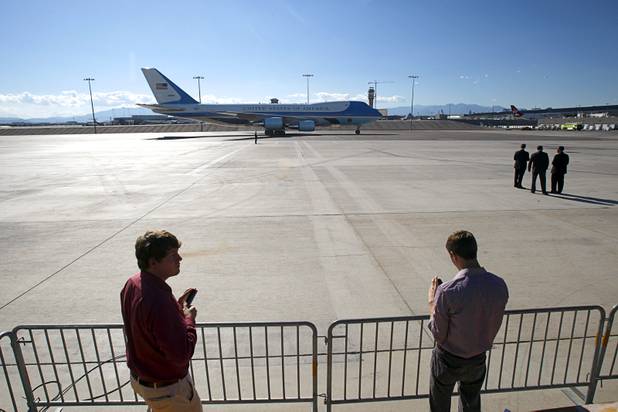 Reporters tweet the arrival of Air Force One at McCarran International Airport Wednesday, Sept. 12, 2012.  President Barack Obama will be making a campaign stop at Cashman Field Center.