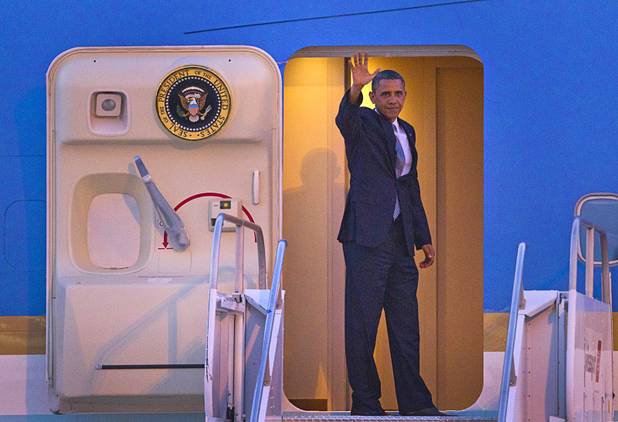 President Barack Obama waves as he boards Air Force One to depart McCarran International Airport Wednesday, Sept. 12, 2012.  Obama rallied supporters during a campaign stop at the Cashman Center.