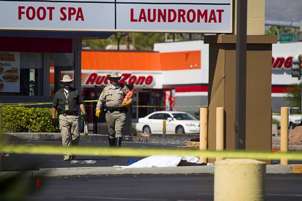 Metro Police investigate after a car crashed into a bus stop on Spring Mountain Road east of Decatur Boulevard, killing four people, on Thursday, Sept. 13, 2012.