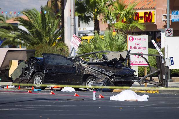 A view of  car that car crashed into a bus stop on Spring Mountain Road east of Decatur Boulevard, killing four people, on Thursday, Sept. 13, 2012.