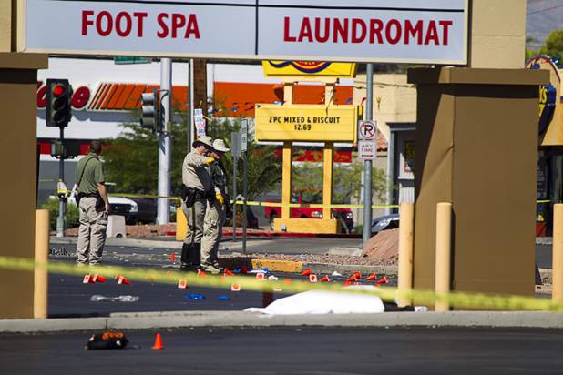 Metro Police investigate after a car crashed into a bus stop on Spring Mountain Road east of Decatur Boulevard, killing four people, on Thursday, Sept. 13, 2012.