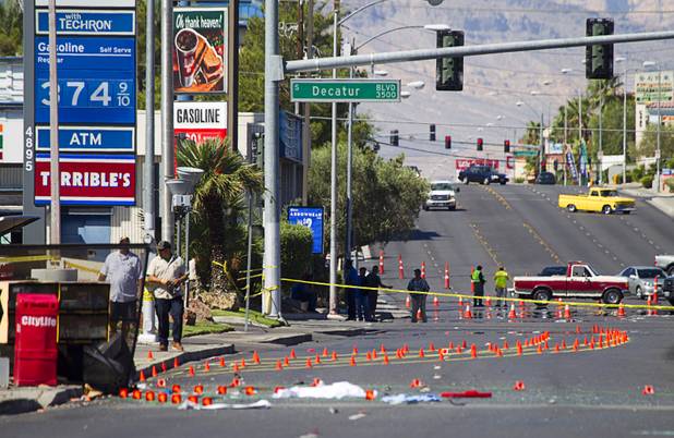 Metro Police investigate after a car crashed into a bus stop on Spring Mountain Road east of Decatur Boulevard, killing four people, on Thursday, Sept. 13, 2012. Photo is looking west on Spring Mountain Road toward Decatur Boulevard.