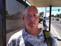 Greg King waits for the bus on Flamingo Road near Decatur on Thursday, Sept 13, 2012, the same day that a car crashed into a bus stop, killing four and injuring eight others.  