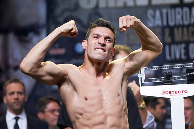 Boxer Sergio Martinez of Argentina flexes after making weight during an official weigh-in at the Wynn Las Vegas Resort in Las Vegas, Nevada Sept. 14, 2012. Martinez will challenge WBC middleweight champion Julio Cesar Chavez Jr., son of boxing legend Julio Cesar Chavez, at the Thomas & Mack Center in Las Vegas September 15.