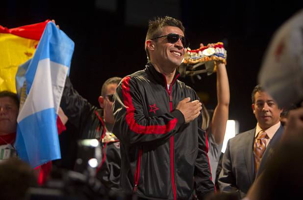 Boxer Sergio Martinez of Argentina reacts to cheers from fans as he arrives for an official weigh-in at the Wynn Las Vegas Resort in Las Vegas, Nevada Sept. 14, 2012. Martinez will challenge WBC middleweight champion Julio Cesar Chavez Jr., son of boxing legend Julio Cesar Chavez, at the Thomas & Mack Center in Las Vegas September 15.