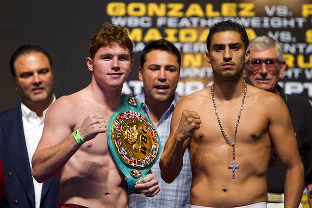 WBC super welterweight champion Canelo Alvarez (L) of Mexico poses with Josesito Lopez of the U.S. during an official weigh-in at the MGM Grand Garden Arena in Las Vegas, Nevada Sept. 14, 2012. Alvarez will defend his title against Lopez at the the arena September 15.