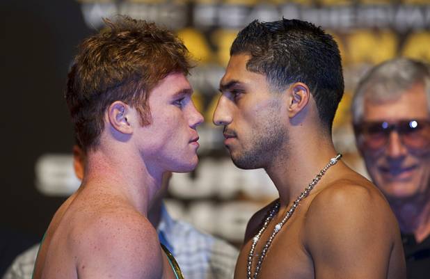 WBC super welterweight champion Canelo Alvarez (L) of Mexico faces off with Josesito Lopez of the U.S. during an official weigh-in at the MGM Grand Garden Arena in Las Vegas, Nevada Sept. 14, 2012. Alvarez will defend his title against Lopez at the the arena September 15.