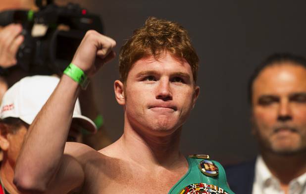 WBC super welterweight champion Canelo Alvarez of Mexico celebrates after making weight during an official weigh-in at the MGM Grand Garden Arena in Las Vegas, Nevada Sept. 14, 2012. Alvarez will defend his title against Josesito Lopez of the U.S. at the the arena September 15.