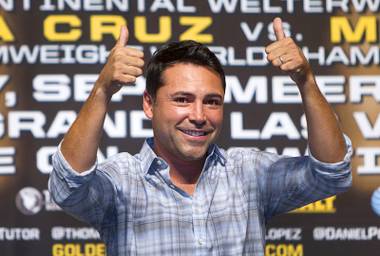 Oscar De La Hoya, president of Golden Boy Promotions, gives a thumbs-up during an official weigh-in at MGM Grand Garden Arena on Sept. 14, 2012, in Las Vegas.