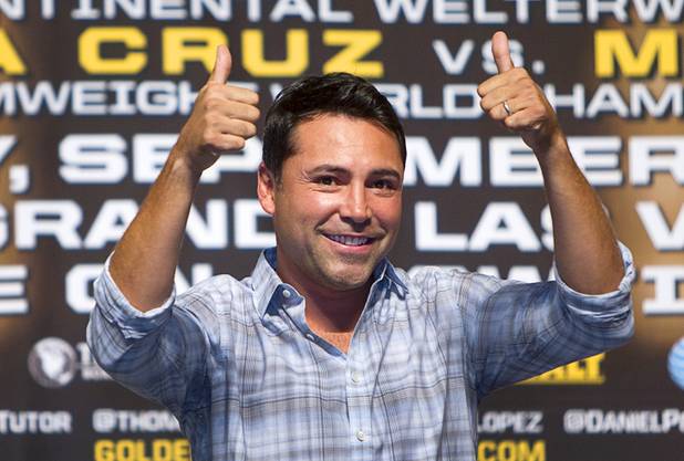 Oscar De La Hoya, president of Golden Boy Promotions, gives a thumbs-up during an official weigh-in at MGM Grand Garden Arena on Sept. 14, 2012, in Las Vegas.
